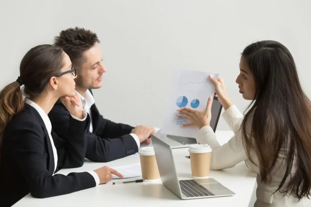 Business team reviewing charts and data during a collaborative meeting