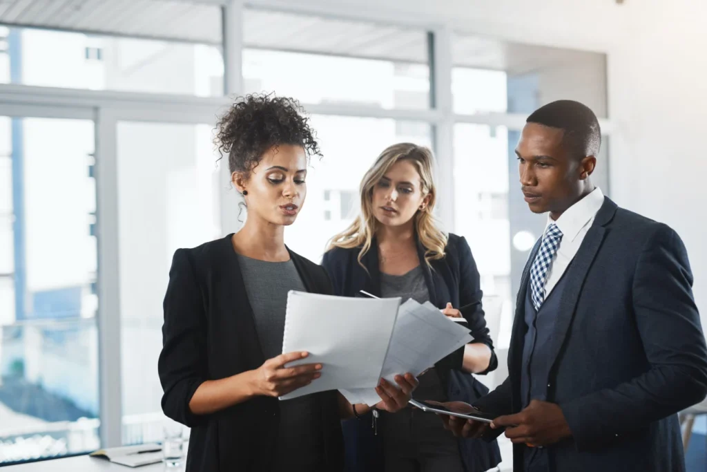 Business team reviewing documents together in an office